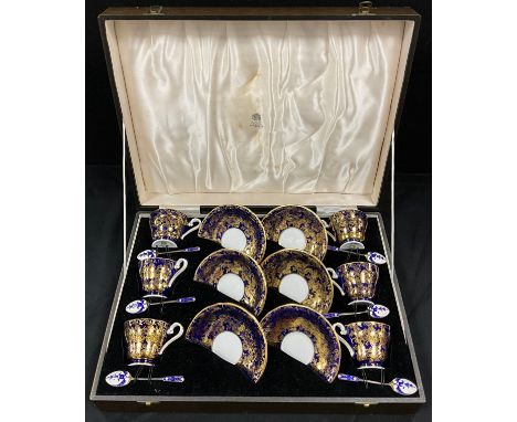 A set of six Aynsley colbalt blue and gilt coffee cups and saucers conforming silver and enamel spoons, Birmingham 1959, prin