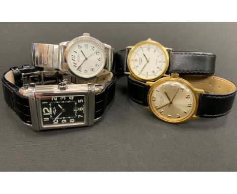 A Rotary Revelation quartz dual-faced wristwatch, revolving reversable case, black rectangular dial, Arabic numerals and date