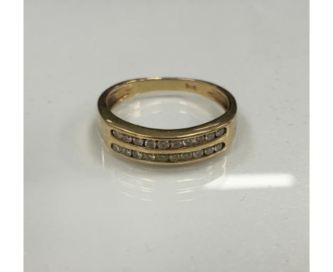 A 9ct gold diamond two channel ring, set with two rows of ten round brilliant cut diamonds, 9ct gold shank,. size L/M, 2g gro