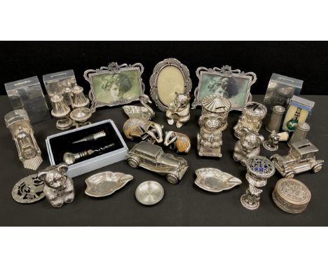 A modern novelty silver plated money bank, as a Motorcar, others, Teddy bears, Train, carousel, etc;  picture frames etc