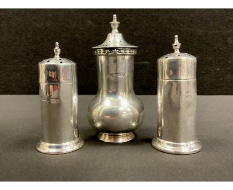 A Walker &amp; Hall silver pepper pot, Sheffield 1928; another pair marks worn, 106g gross (3)