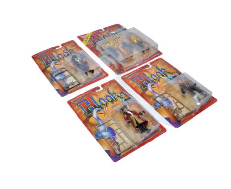 Mattel group of Four Carded Hook figures, factory sealed with little sign of card wear. . 