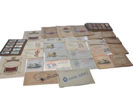 A large collection of vintage Wills / John Player and other Cigarette Cards contained within various albums as shown. Whilst 