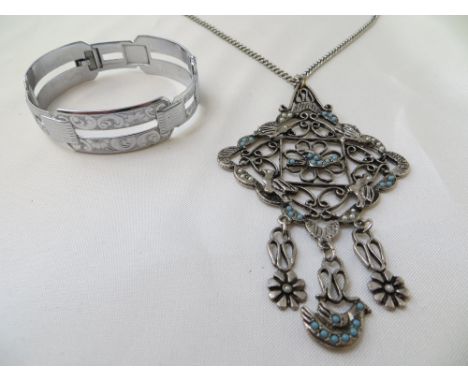 An art deco style white metal pendant and bracelet.