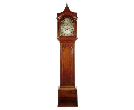An eight day oak longcase clock, 12 inch brass dial signed Jno. Johnson, Halesworth in the foliate engraved silvered centre, 