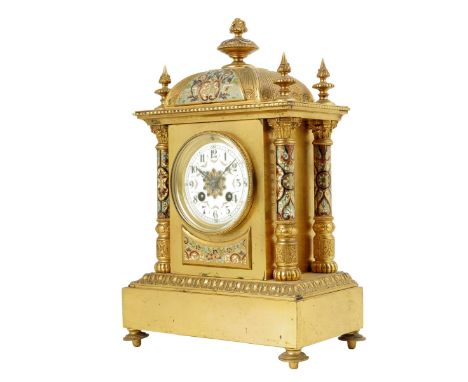 A French gilt brass and enamel mantel clock, striking drum movement with cream enamel dial and floral swags, in an architectu