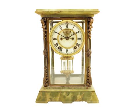 A brass and green onyx four glass mantel clock, striking movement by Ansonia, New York with visible Brocot type escapement, s