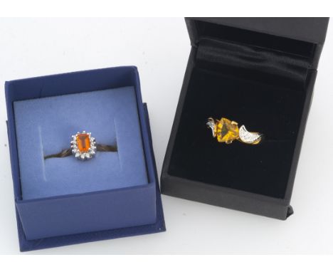 Two 9ct gold fire opal and diamond dress rings, comprising one rectangular cut with claw setting, surrounded by a diamond bez