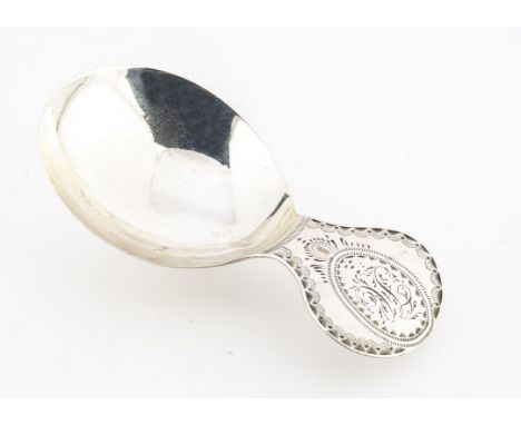 A George III period silver tea caddy spoon by JS, 7.4cm long, 8.5g, with round handle having bright cut decoration and initia