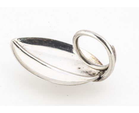 A 1960s Elizabeth II silver tea caddy spoon by A.E. Jones, 6cm and 15.4g, in the form of a tea leaf with coiled handle, Birmi