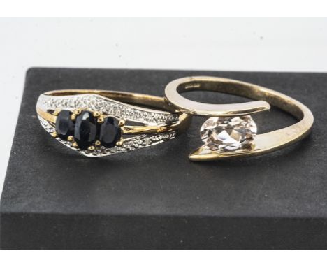 A 9ct gold diamond and sapphire dress ring,  three oval mixed cut gems in claw settings, ring size P, together with a cross o