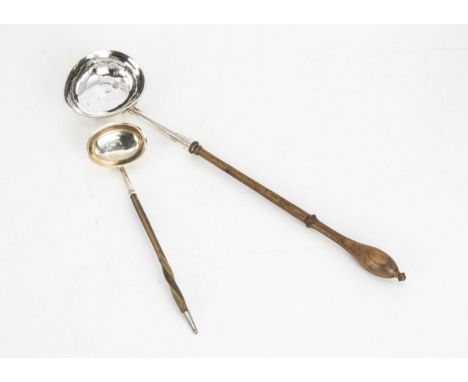 A George III silver toddy ladle and another smaller example, the larger 32.5cm with turned wooden handle, the smaller Scottis