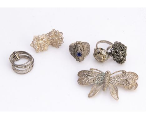 Seven vintage items of filigree and similar jewellery, three rings, a butterfly shaped brooch and a pair of earrings 
