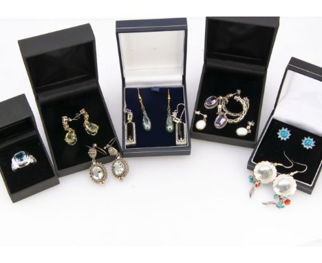 A collection of four silver gemset rings, another silver ring with an opal and pair of matching earrings, and eight silver bo