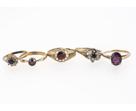 A collection of gem set rings, including an oval garnet example, a garnet signet ring, an early 20th century example and othe
