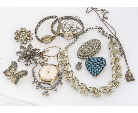 A large collection of silver and costume jewels, including a quartz silver pendant and chain, a garnet cross, a blue CZ suit 