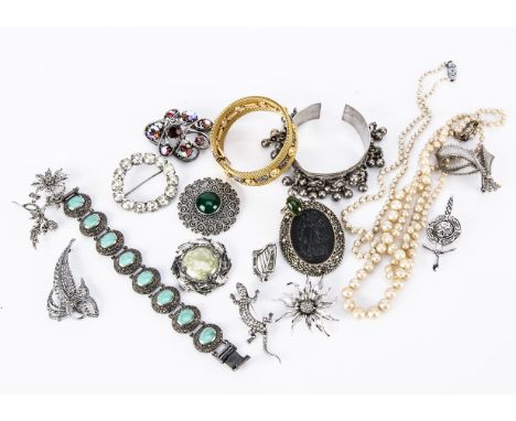 A continental white metal and turquoise bracelet, the oval cabochons in rubbed over setting, stepped oval mounts set with mar