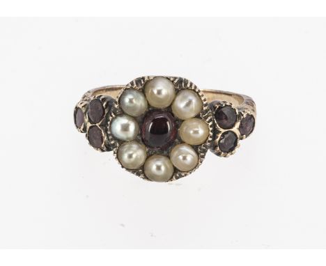 A  Georgian inscribed and dated mourning ring,  central garnet cabochon surround by seed pearls , having amethyst set trefoil