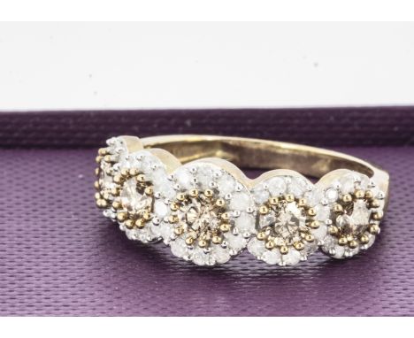 A 9ct gold five stone diamond ring, circular cut colour enhanced diamonds, surrounded in scrolls of colourless diamond, ring 