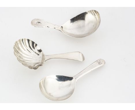 Three George III period silver tea caddy spoons, one with shell shaped bowl, the other two with plain bowls, AF 