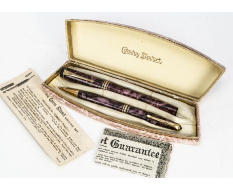 A vintage Conway Stewart writing set, the purple mottled fountain pen and pencil in CS box 