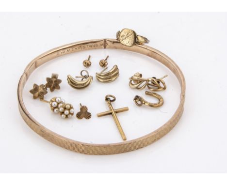A 9ct gold arm bangle,  with engine turned decoration, a 9ct gold ring, a gold cross pendant, various earrings and other gold