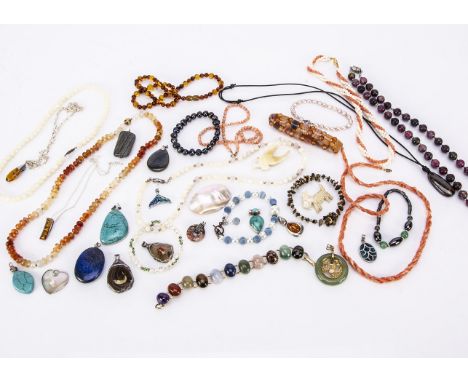 A collection of hardstone and amber jewels, including an amber necklace, turquoise pendant, a labradorite example, silver set