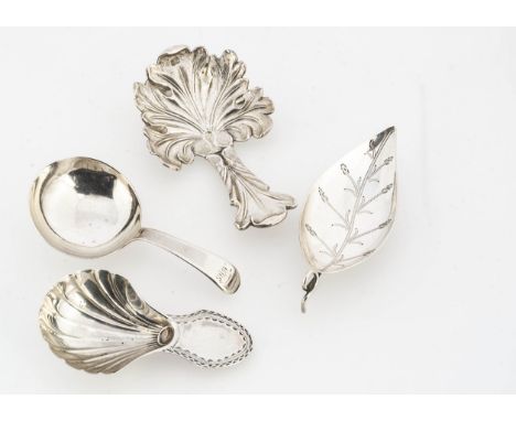 Four George III period silver tea caddy spoons, one tea leaf shaped, one acanthus leaf shaped, one with shell bowl and one wi