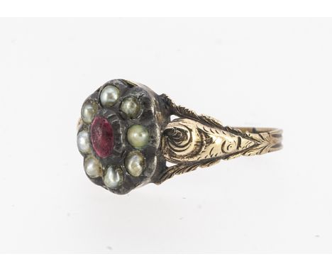 A Georgian plaited hair red paste and seed pearl ring, the central paste stone surrounded by half cut pearls, with a box back