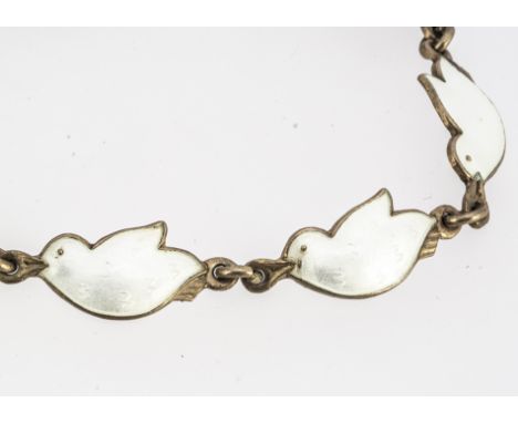 A mid century Norwegian child's silver and enamel bracelet  by J Tostrup, made up of seven white dove links, marked to one li