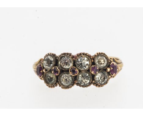 A Victorian 9ct gold paste set dress ring, two rows of circular colourless paste stones, inter set with mixed oval small rubi