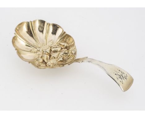 A George III period silver gilt tea caddy spoon by Samuel Pemberton, 8.9cm long and 10.3g, shaped bowl with embossed shell de