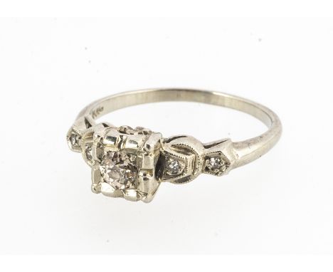A continental old cut diamond solitaire ring, the old cut diamond in white metal square setting, with floral gallery, stepped