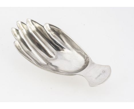 A 1970s Elizabeth II period silver tea caddy spoon by FH, 7.2cm long and 14.3g, in the form of a hand, Sheffield 1971 