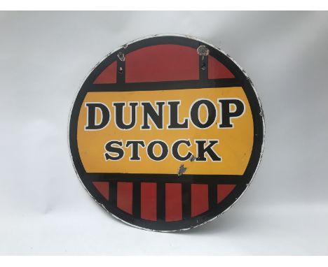 A Dunlop Stock circular double sided enamel sign with good gloss, 18" diameter. 