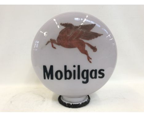 A rare Mobil pill shaped glass petrol pump globe, in good condition, slightly faded.