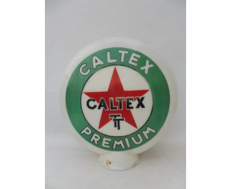 A Caltex TT Premium glass petrol pump globe by Webbs Crystal, chipping to neck. 