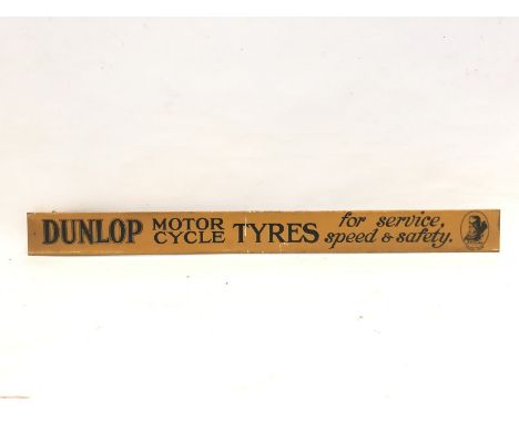 An early and rare Dunlop Motor Cycle Tyres shelf strip with image of Mr. Dunlop to one end.