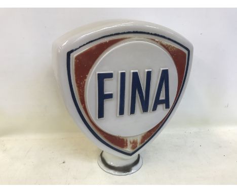 A Fina glass petrol pump globe with slight fading.