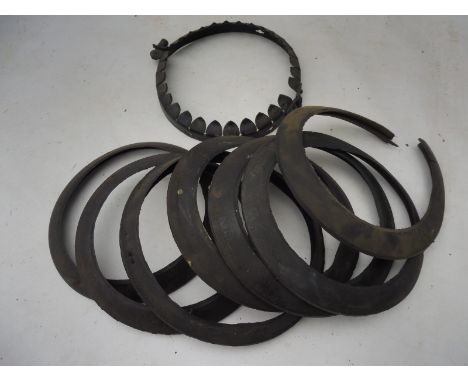 An original metal globe ring for clamping to a petrol pump and a selection of old rubber rings.