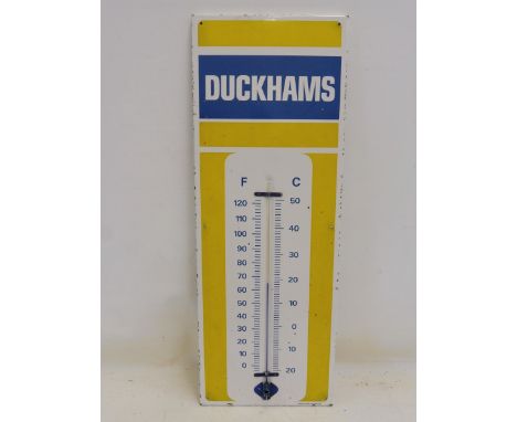 A Duckhams enamel thermometer by Burnham, 13 x 36".