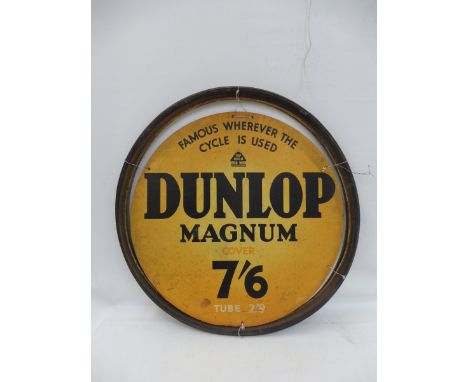 A Dunlop Magnum circular cardboard advertisement set within a rubber tyre, overall 27 1/2" diameter.