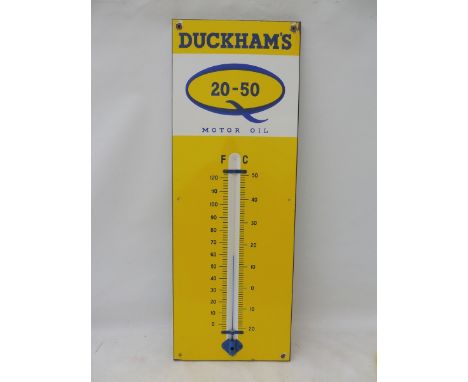 A Duckham's 20-50 Motor Oil enamel thermometer, in excellent condition, 13 x 36". 