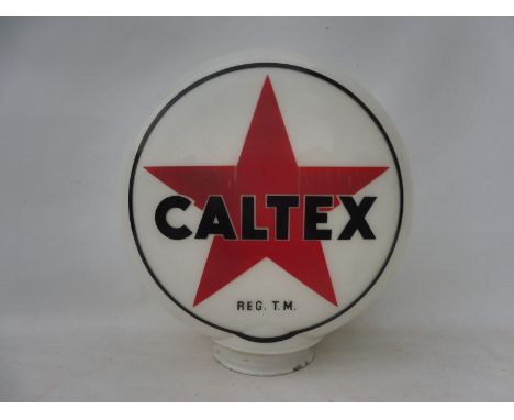 A Caltex glass petrol pump globe, one side slightly faded and some nibbling to the neck, stamped: Made in England.