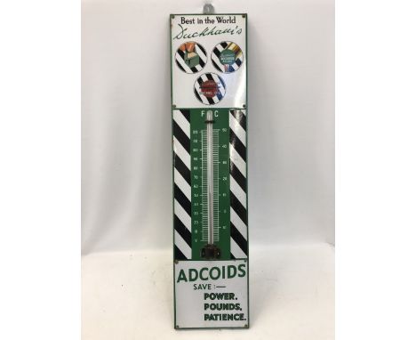 A Duckham's Adcoids black and white enamel thermometer, in good condition, 11 x 45 1/2". 