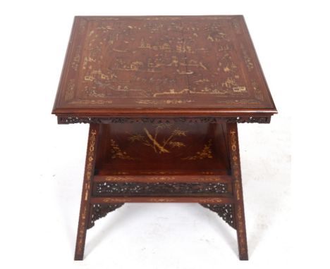 A Chinese two tier occasional table, inlaid with bone decorated figures, pergodas and trees, 63 cm wide See illustration

 