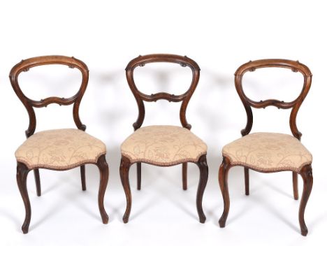 A set of six Victorian rosewood balloon back dining chairs, on carved cabriole legs, and a commode, converted (7) See illustr