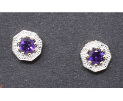 A pair of 9ct gold, amethyst and diamond earrings

Modern 