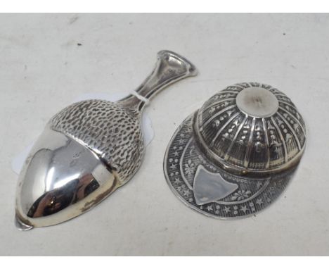 A novelty silver jockey cap caddy spoon, and another, in the form of an acorn (2)

Modern 