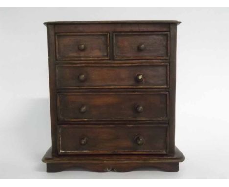 Late 19th/early 20th century stained pine apprentice chest fitted with two drawers over three full width drawers, with turned